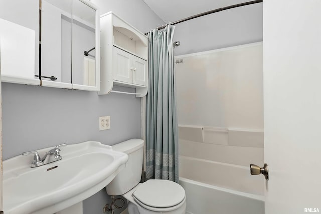 3129 Harrison St, Davenport, IA 52803 - full bathroom featuring a sink, toilet, and shower / tub combo with curtain