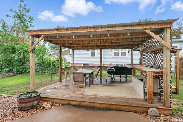 3129 Harrison St, Davenport, IA 52803 - wooden terrace with grilling area and outdoor dining area