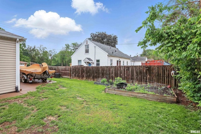 3129 Harrison St, Davenport, IA 52803 - view of yard featuring a vegetable garden