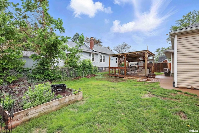 3129 Harrison St, Davenport, IA 52803 - view of yard featuring a garden and a wooden deck