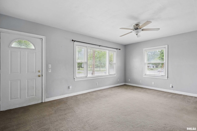 3129 Harrison St, Davenport, IA 52803 - entrance foyer featuring ceiling fan, baseboards, and carpet