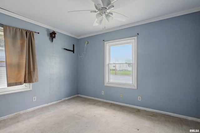 3129 Harrison St, Davenport, IA 52803 - carpeted empty room featuring baseboards, a ceiling fan, and ornamental molding