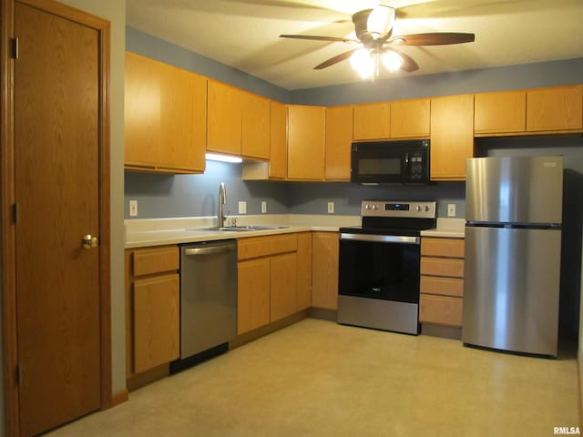 4186 Fairview Dr Unit 5, Bettendorf, IA 52722 - kitchen with appliances with stainless steel finishes, a sink, light countertops, light flooring, and a ceiling fan