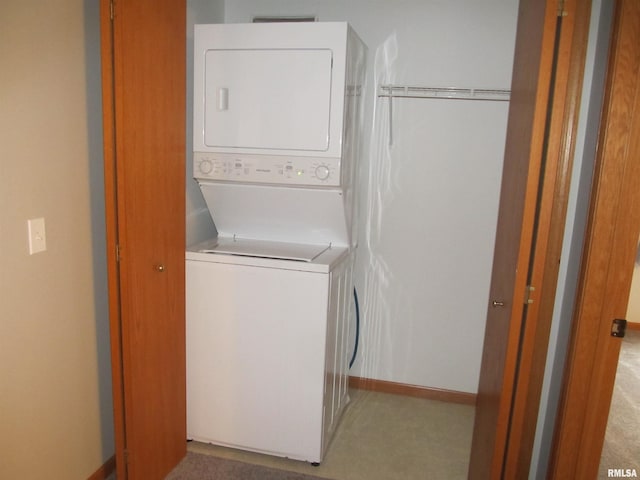 4186 Fairview Dr Unit 5, Bettendorf, IA 52722 - laundry room featuring stacked washer / drying machine and baseboards