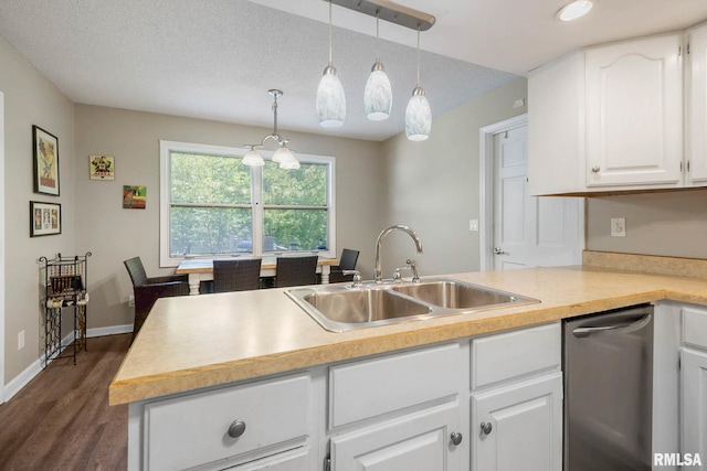 1816 Calico Rd, Marion, IL 62959 - kitchen featuring stainless steel dishwasher, a sink, dark wood-style flooring, light countertops, and white cabinetry
