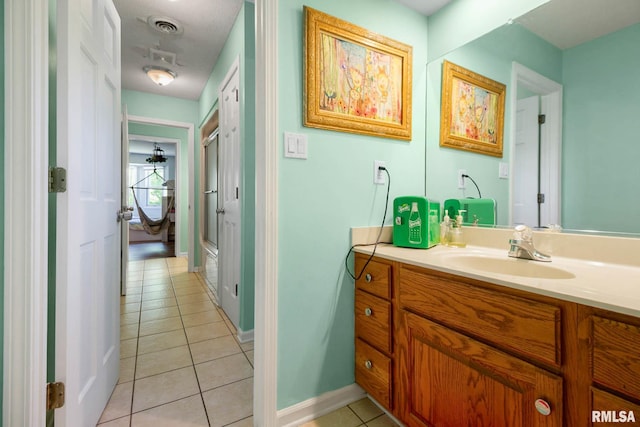 1816 Calico Rd, Marion, IL 62959 - full bathroom with vanity, tile patterned flooring, a shower with shower door, and baseboards