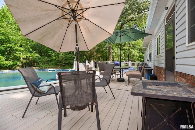 1816 Calico Rd, Marion, IL 62959 - wooden deck featuring outdoor dining area and an outdoor pool