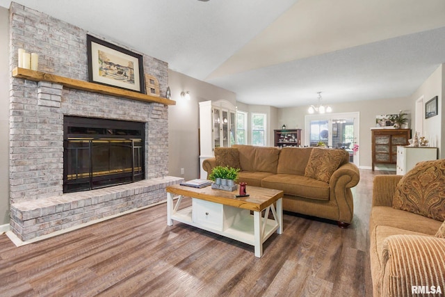 1816 Calico Rd, Marion, IL 62959 - living area featuring wood finished floors, a brick fireplace, and a chandelier