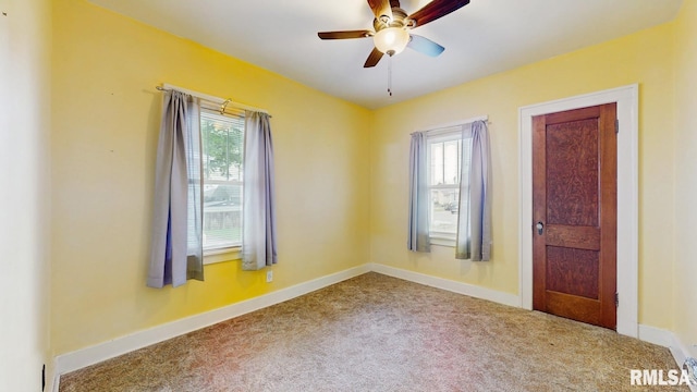 506 18th Ave, Moline, IL 61265 - empty room with healthy amount of natural light, carpet, a ceiling fan, and baseboards