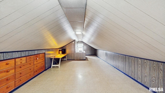 506 18th Ave, Moline, IL 61265 - additional living space featuring tile patterned floors, wood walls, and lofted ceiling