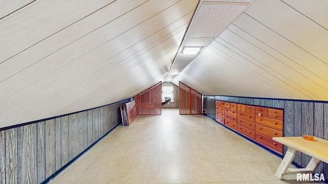 506 18th Ave, Moline, IL 61265 - additional living space with tile patterned floors, wood walls, and lofted ceiling
