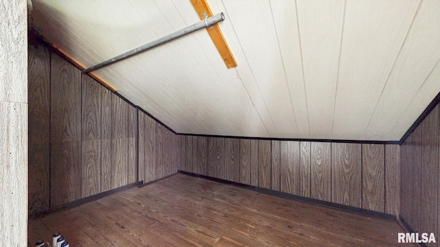 506 18th Ave, Moline, IL 61265 - additional living space featuring dark wood-style floors, vaulted ceiling, and wooden walls