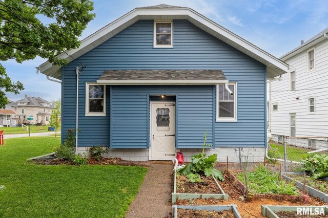 506 18th Ave, Moline, IL 61265 - view of front facade featuring a vegetable garden and roof with shingles