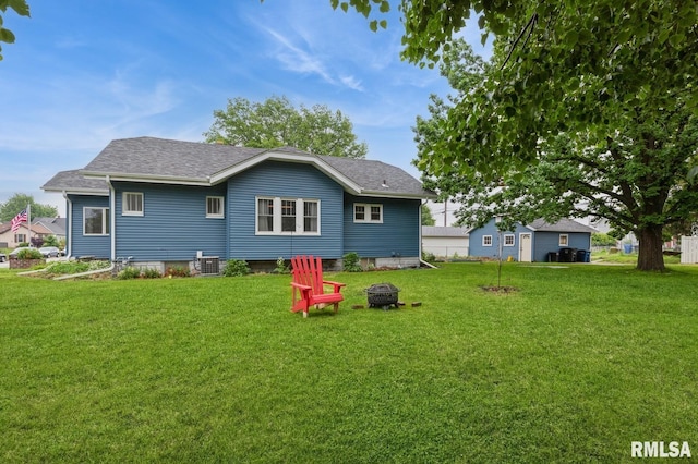 506 18th Ave, Moline, IL 61265 - back of house with a yard, central AC unit, and a fire pit