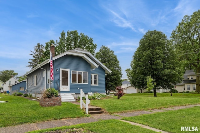 506 18th Ave, Moline, IL 61265 - view of front of property with a front yard and a chimney