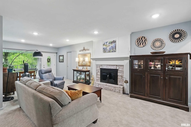 1104 Kimberly Rd Unit 1006, Bettendorf, IA 52722 - living room featuring light colored carpet, a fireplace, and recessed lighting