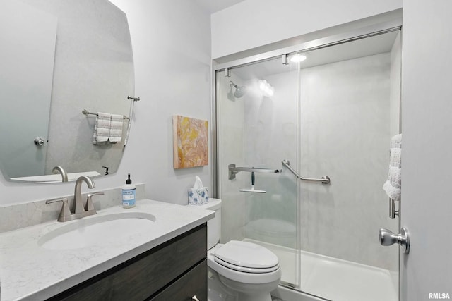 1104 Kimberly Rd Unit 1006, Bettendorf, IA 52722 - bathroom with vanity, a stall shower, and toilet