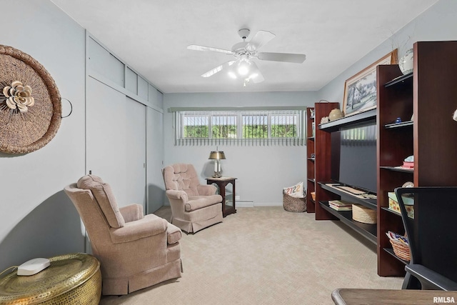 1104 Kimberly Rd Unit 1006, Bettendorf, IA 52722 - sitting room with light carpet, a ceiling fan, and baseboards