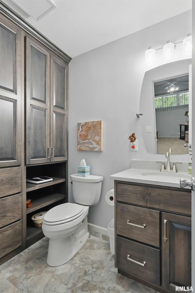 1104 Kimberly Rd Unit 1006, Bettendorf, IA 52722 - bathroom featuring vanity, toilet, and baseboards
