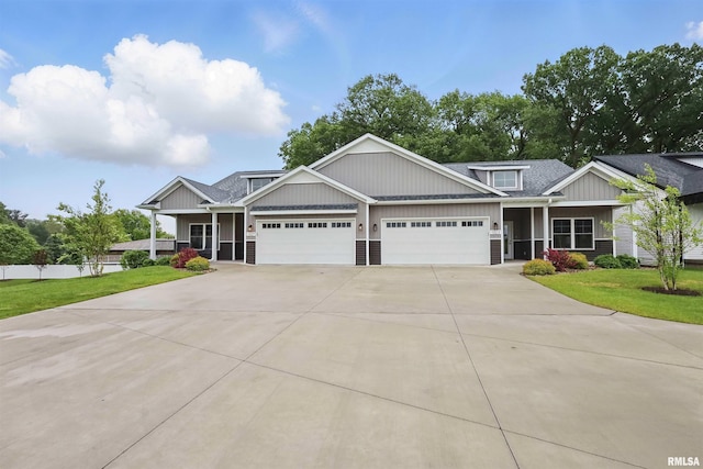 1327 Heights Ct, Bettendorf, IA 52803 - craftsman house featuring driveway, an attached garage, board and batten siding, and a shingled roof