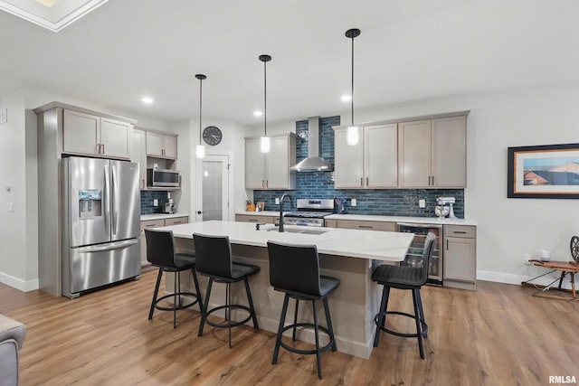 1327 Heights Ct, Bettendorf, IA 52803 - kitchen featuring appliances with stainless steel finishes, wall chimney range hood, wine cooler, a sink, and a kitchen breakfast bar