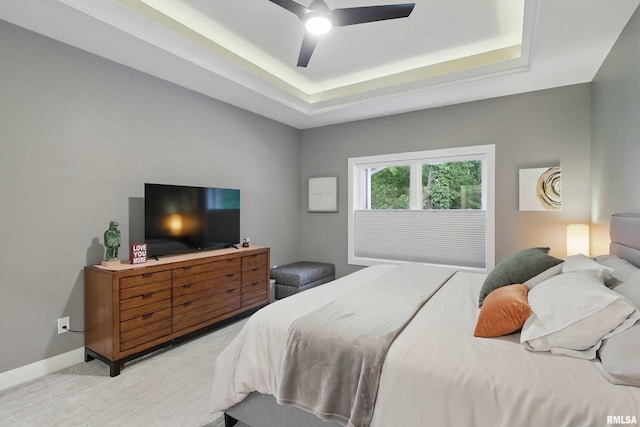 1327 Heights Ct, Bettendorf, IA 52803 - bedroom featuring a raised ceiling, light carpet, and ceiling fan