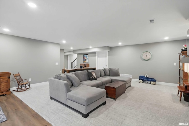 1327 Heights Ct, Bettendorf, IA 52803 - living area featuring recessed lighting, stairs, baseboards, and wood finished floors