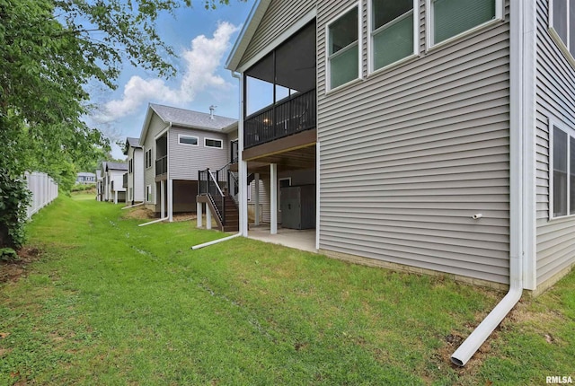 1327 Heights Ct, Bettendorf, IA 52803 - rear view of property with a lawn, stairway, a patio, and a deck