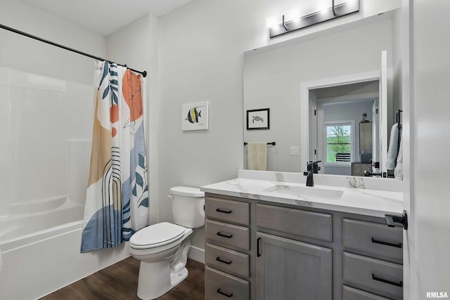 1327 Heights Ct, Bettendorf, IA 52803 - full bathroom featuring vanity, toilet, wood finished floors, and shower / bath combo