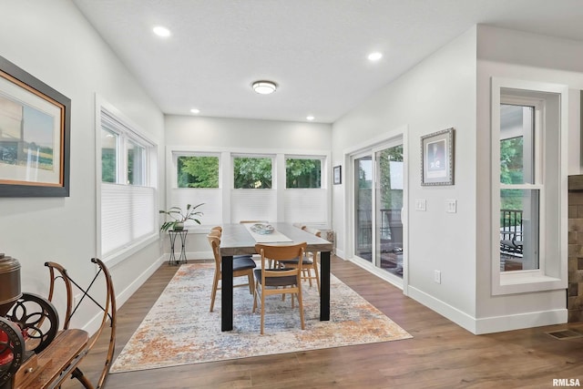 1327 Heights Ct, Bettendorf, IA 52803 - dining area featuring dark wood-type flooring, baseboards, and recessed lighting