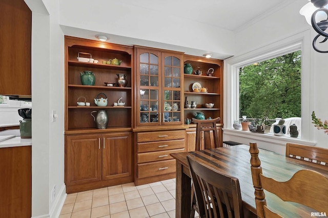 923 22nd St, Moline, IL 61265 - dining room featuring light tile patterned flooring and ornamental molding