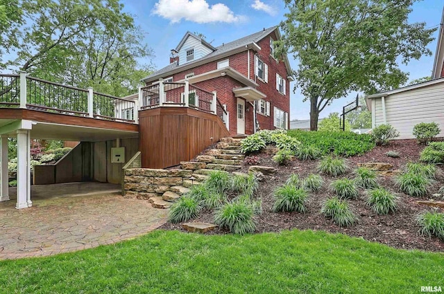 923 22nd St, Moline, IL 61265 - view of property exterior featuring brick siding, a deck, and stairway