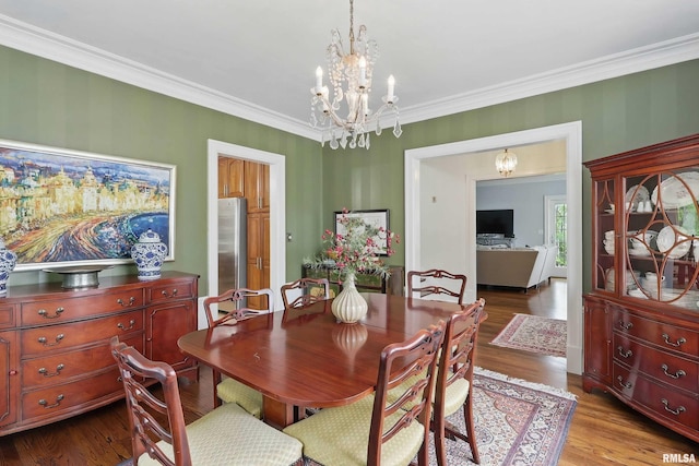 923 22nd St, Moline, IL 61265 - dining room with a chandelier, wood finished floors, and crown molding