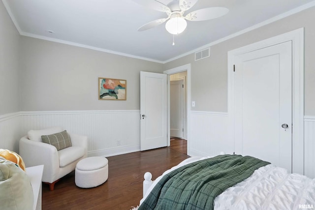 923 22nd St, Moline, IL 61265 - bedroom with wood finished floors, a wainscoted wall, ornamental molding, and ceiling fan