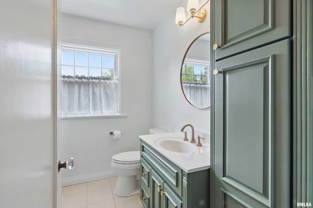 923 22nd St, Moline, IL 61265 - bathroom with tile patterned flooring, vanity, toilet, and baseboards