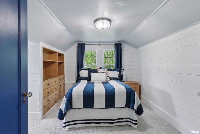 923 22nd St, Moline, IL 61265 - carpeted bedroom featuring lofted ceiling and wooden walls