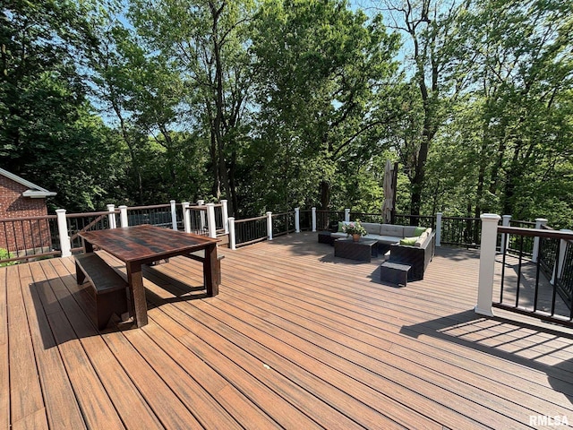 923 22nd St, Moline, IL 61265 - wooden deck with an outdoor hangout area, outdoor dining space, and view of wooded area