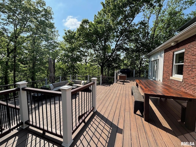 923 22nd St, Moline, IL 61265 - wooden terrace with an outdoor living space, outdoor dining area, and view of wooded area