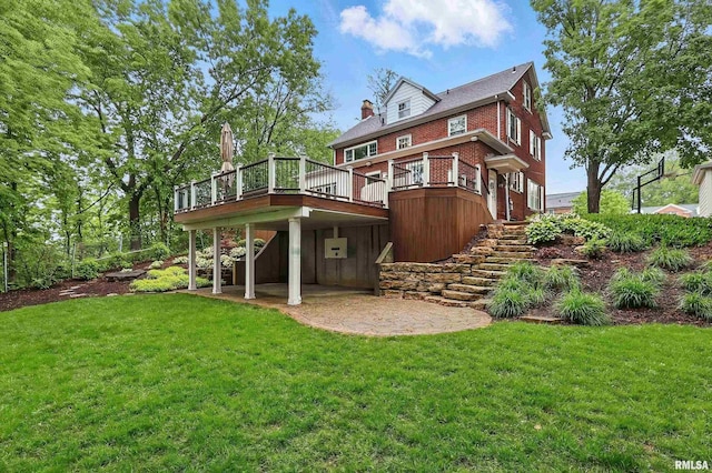 923 22nd St, Moline, IL 61265 - rear view of property featuring a yard, a deck, a patio area, and stairway