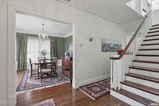 923 22nd St, Moline, IL 61265 - entryway with ornamental molding, stairs, plenty of natural light, and wood finished floors