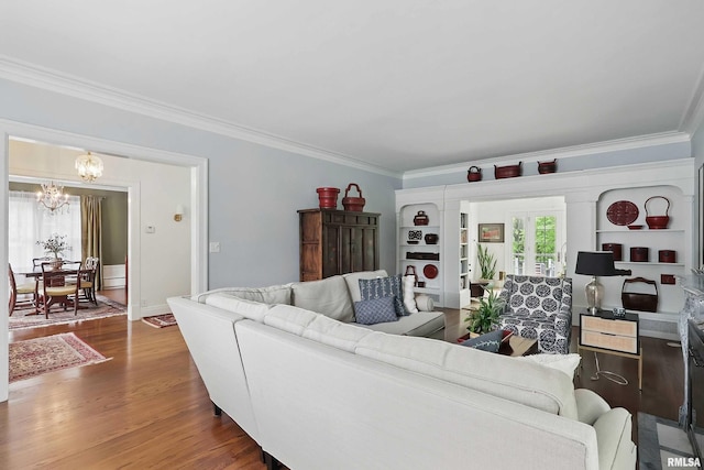 923 22nd St, Moline, IL 61265 - living area featuring crown molding, a chandelier, wood finished floors, and french doors