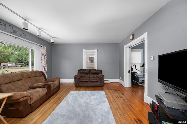 503 SW 4th Ave, Galva, IL 61434 - living room with wood finished floors, baseboards, and a baseboard radiator