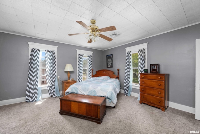 503 SW 4th Ave, Galva, IL 61434 - carpeted bedroom with multiple windows, baseboards, ceiling fan, and ornamental molding