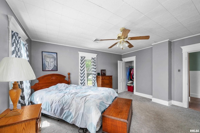 503 SW 4th Ave, Galva, IL 61434 - carpeted bedroom with ornamental molding, a ceiling fan, a closet, and baseboards