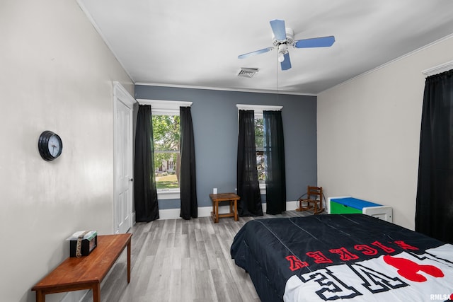 503 SW 4th Ave, Galva, IL 61434 - bedroom with light wood finished floors, a ceiling fan, baseboards, and crown molding