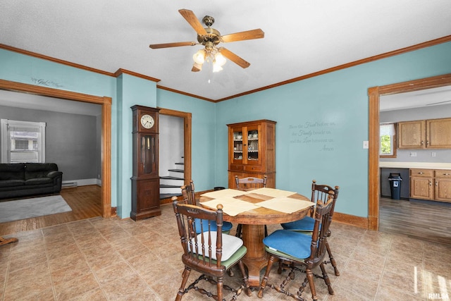 503 SW 4th Ave, Galva, IL 61434 - dining room with ceiling fan, baseboards, ornamental molding, stairway, and a baseboard radiator