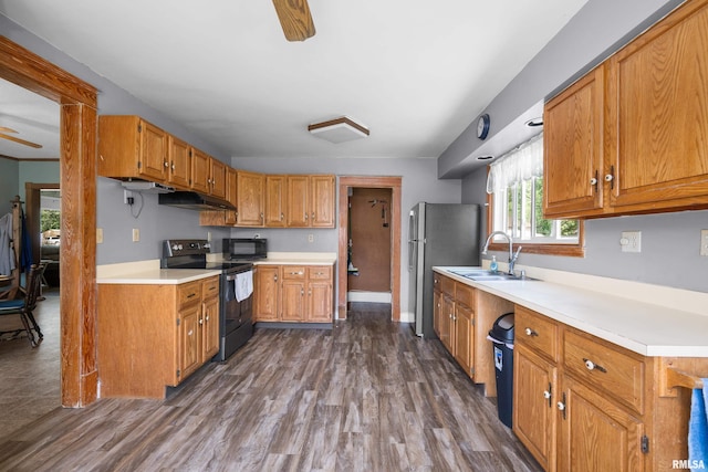 503 SW 4th Ave, Galva, IL 61434 - kitchen with black appliances, a sink, ceiling fan, light countertops, and dark wood-type flooring