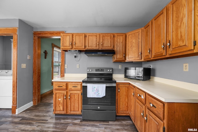 503 SW 4th Ave, Galva, IL 61434 - kitchen featuring electric stove, washer / clothes dryer, under cabinet range hood, light countertops, and dark wood finished floors