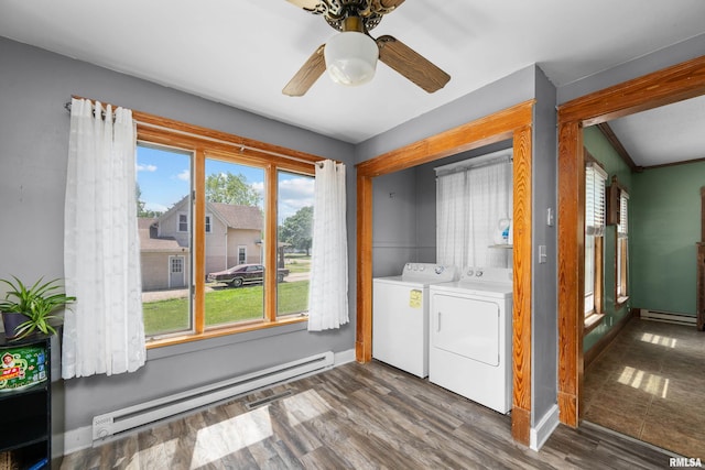 503 SW 4th Ave, Galva, IL 61434 - washroom featuring a baseboard radiator, separate washer and dryer, ceiling fan, dark wood-style floors, and baseboards