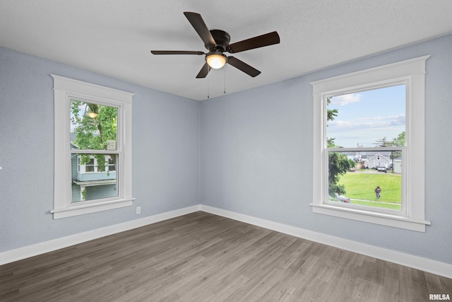 1312 Ripley St, Davenport, IA 52803 - unfurnished room with wood finished floors, baseboards, and a ceiling fan